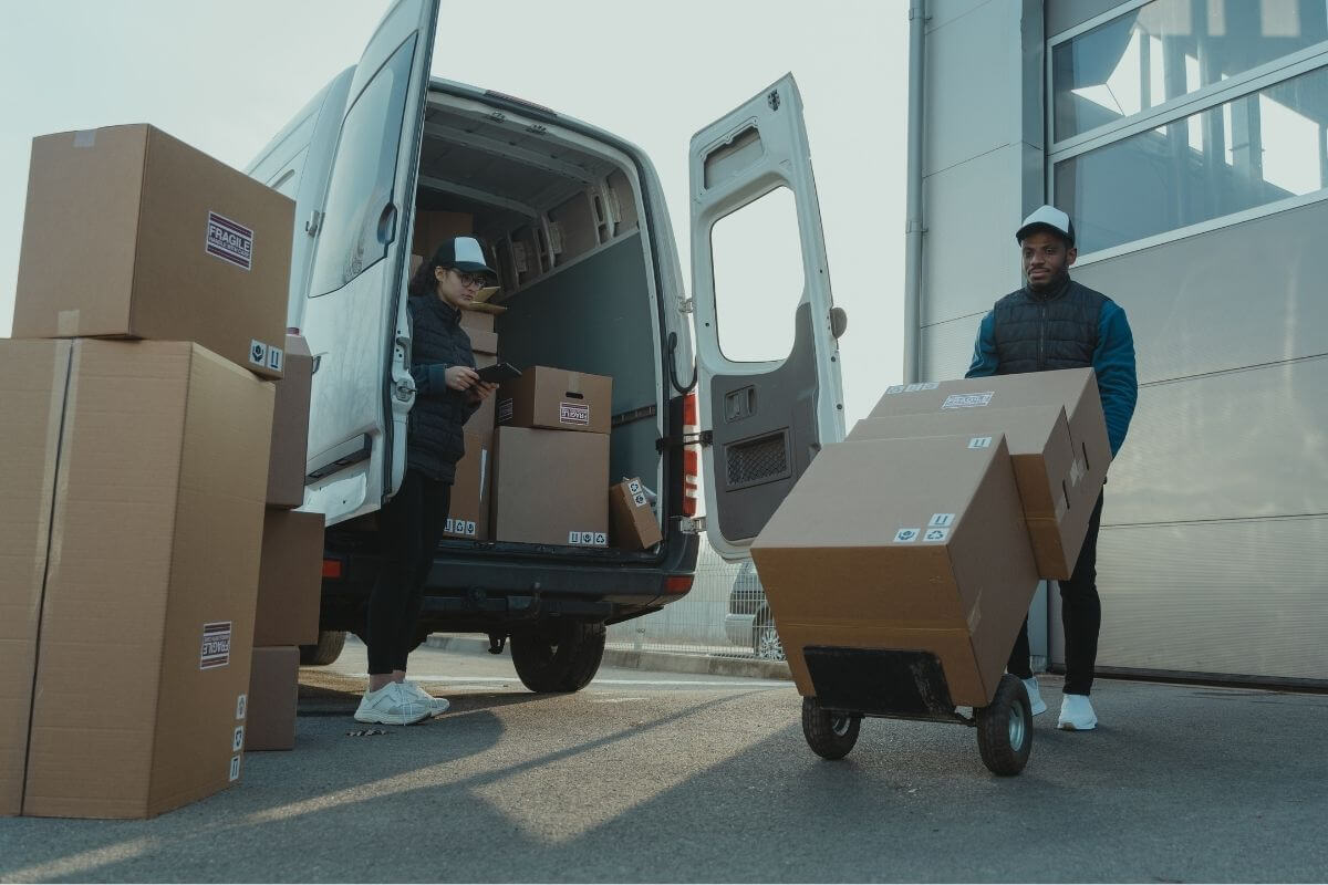 mover bringing boxes to moving truck