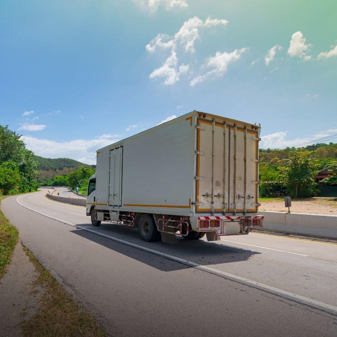 moving truck driving on road