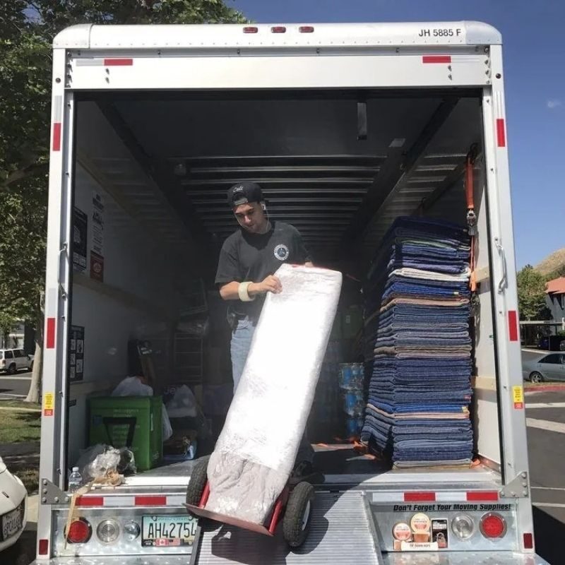 open moving truck with commercial equipment inside