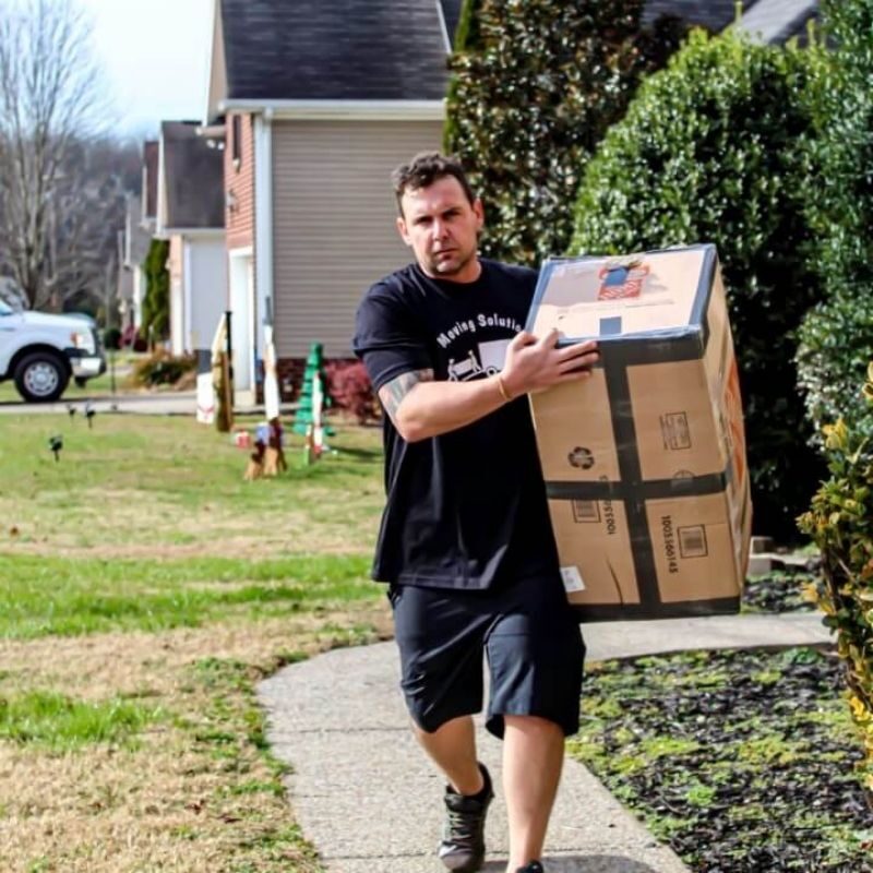 mover bringing box to truck